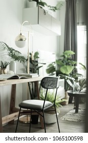 Working corner in apartment with Scandinavian style decoration and artificial plants in background / Cozy Interior Concept / Cozy Working corner