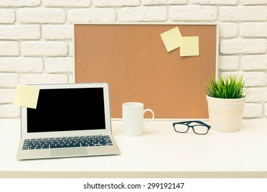 Working Desk, Laptop, Cork Board. Office Interior