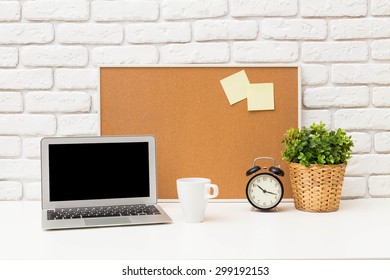 Working Desk, Laptop, Cork Board. Office Interior