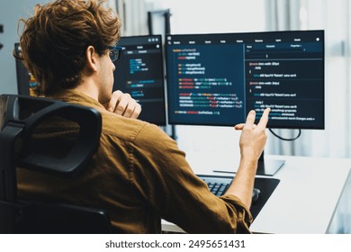Working IT developer with stressful overworked in creating online software development coding on pc screen, thinking program for latest version application on website project at modern office. Gusher.