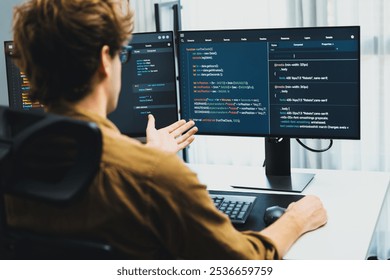 Working IT developer with stressful overworked in creating online software development coding on pc screen, thinking program for latest version application on website project at modern office. Gusher.