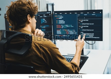Working IT developer with stressful overworked in creating online software development coding on pc screen, thinking program for latest version application on website project at modern office. Gusher.