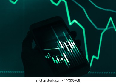 Working with digital tablet computer and smart phone with digital business strategy layer effect and the digital chart. Green Tone.