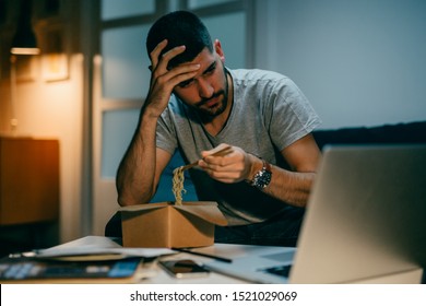 Working And Eating Late. Man Eating Chinese Food And Working On Laptop Computer. Night Scene