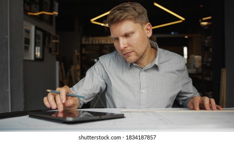 Working Engeneer At The Desk In The Office