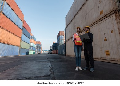 working engineer in the construction container yard.  worker and supervisor checking containers data. Container Shipping Logistics Engineering concept