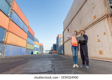 working engineer in the construction container yard.  worker and supervisor checking containers data. Container Shipping Logistics Engineering concept