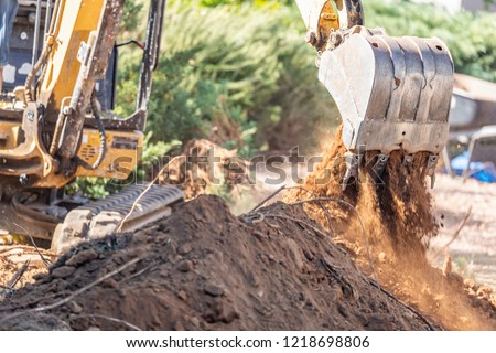 Working Excavator Tractor Digging A Trench At Construction Site.