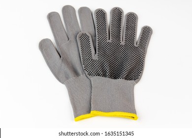 Working grey knitted gloves isolated on a white background. Special gloves are designed for various household tasks.