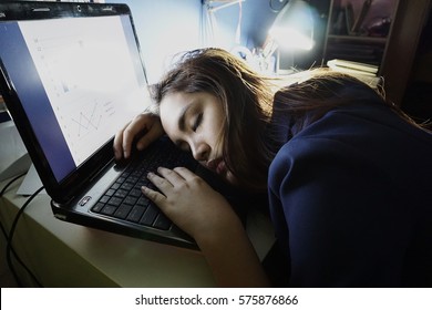                                Working hard women fall sleep at office at night 