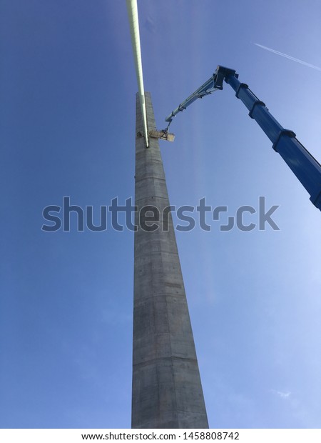 Working at height on\
the construction of a new cable stayed bridge. Civil engineering\
work on a modern suspension work. Rope access and Mobile elevated\
working platforms.