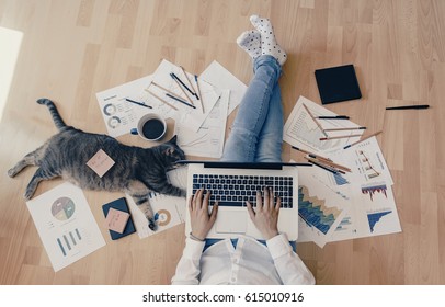 Working home concept - girl with smart phone, laptop and business reports. - Shutterstock ID 615010916