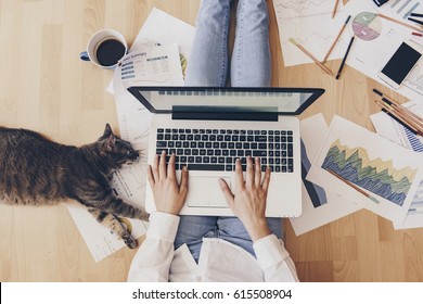 Working home concept - girl with smart phone, laptop and business reports. - Shutterstock ID 615508904