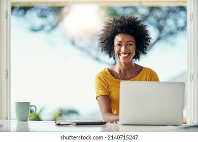 Working From Home Is Great. Cropped Portrait Of An Attractive Young Woman Working On Her Laptop At Home.