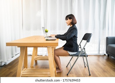 Working At Home Modern Office Businesswoman Meeting Team Online Video Chat Conference Discussing Planning View Of A Person Wearing A Suit Or Business Wear On Top And Sweatpants Or Boxers On Bottom