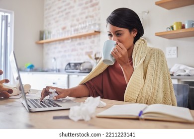 Working From Home, A Woman Sick With Covid Virus Or Flu And Doing Business Email With Laptop On The Kitchen Table. Remote Office Work, Online Employee Has Tea And Blanket To Stay Warm In Poor Health