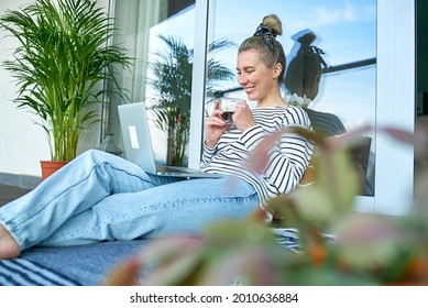 Working From Home. Woman Talking On Video Call With Family, Using Laptop And Drinking Tea. Online Chat. Spend Free Time On Terrace. Staying Connected, Social Distancing, Internet, Chatting.