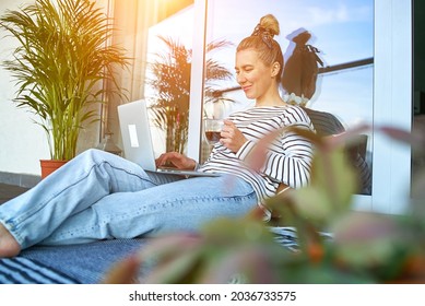 Working From Home. Woman Talking On Video Call With Family, Using Laptop And Drinking Tea. Online Chat. Spend Free Time On Terrace. Staying Connected, Social Distancing, Internet, Chatting.