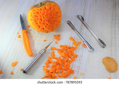 Working In Kitchen On Carving Pumpkin Flower With Carving Knife And Chef Knife Ready For Halloween ,birthday Party Or Just As Table Decoration