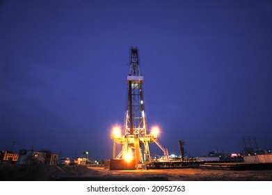 Working land drilling rig in night