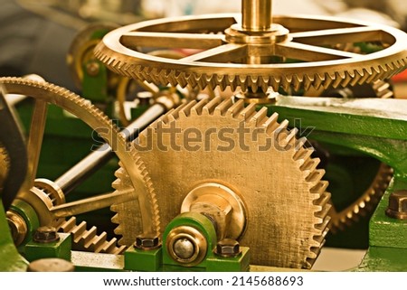 Working like a well-oiled machine. Clockwork machinery that looks well-maintained.