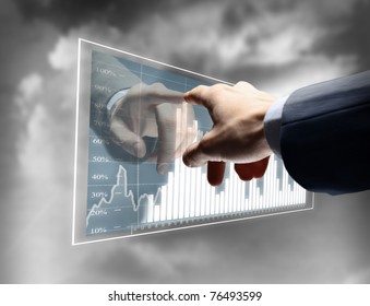 Working man drawing color graphics devoted to business - Powered by Shutterstock