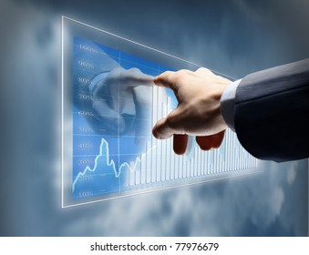 Working man drawing color graphics devoted to business - Powered by Shutterstock