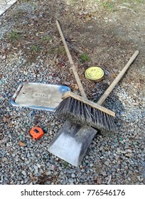 Working man's tools on ground.