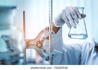 Working Of Microscope With Lab Glassware, Science Laboratory Research And Development Concept