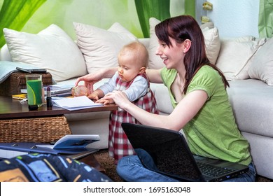 Working Mom With Baby In Her Chaotic Home Office