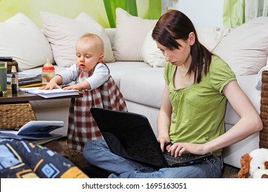 Working Mom With Baby In Her Chaotic Home Office