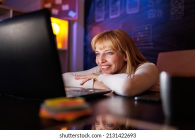 Working Mom Having Video Call With Kids Using Laptop Computer While Working In An Office Late At Night