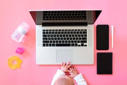 Working Mom Top View Flatlay Of Workplace Baby Items And Laptop With Phone