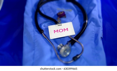 Working Mom/women In Healthcare/ Blue Scrubs With Stethoscope And  Name Badge. 