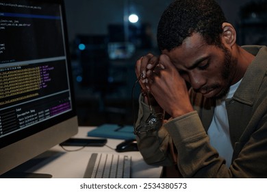 Working at Night with Computer in Office Environment - Powered by Shutterstock