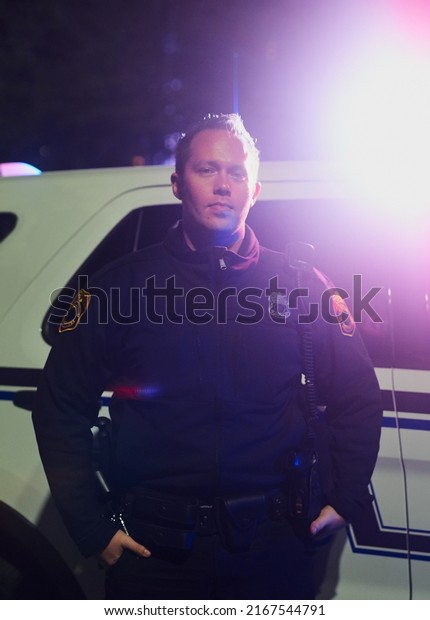 Working the night shift. Cropped portrait of a\
handsome young policeman out on\
patrol.