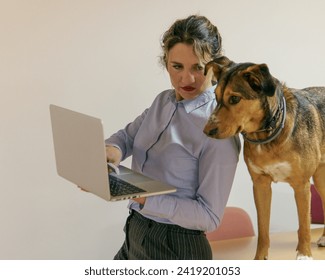 working in the office with the computer and with the dog by my side