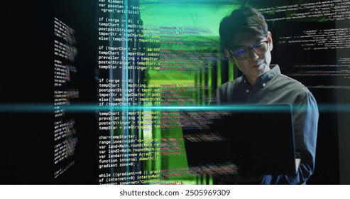 Working on laptop, man in server room with coding image over green light. Technology, programming, cybersecurity, data, infrastructure, networking