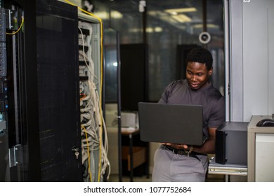 Working On A Laptop In Server Room