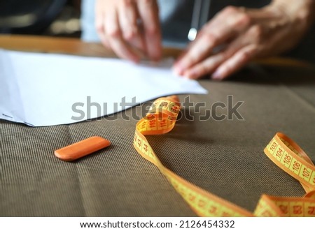 Working process of a dressmaker. Work at home. Closeup photo with selective focus