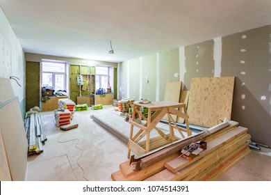 Working process of installing metal frames for plasterboard -drywall - for making gypsum walls  in apartment is under construction, remodeling, renovation, extension, restoration and reconstruction. 