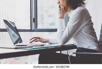 Working Process in Modern Office. Young Woman Account Manager Working at Wood Table with New Business Project. Typing keyboard,Using Contemporary Laptop. Horizontal. Film effect. Blurred background. - Powered by Shutterstock