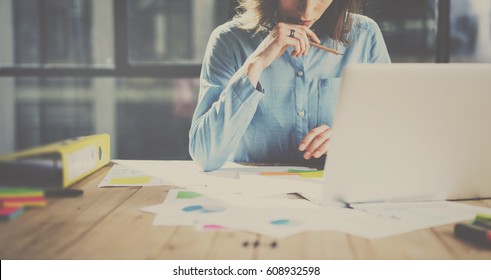 Working process photo. Account manager working wood table with new business project. Typing contemporary smartphone screen. Horizontal. Film and flares effects. - Shutterstock ID 608932598