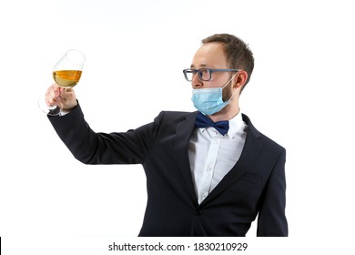 Working In Protective Face Mask. Portrait Of Male Sommelier, Wine Steward Or Bar Worker In White And Black Suit Isolated Over White Background. Copyspace For Ad. Concept Of Professional Occupation