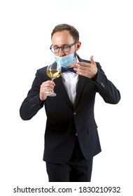 Working In Protective Face Mask. Portrait Of Male Sommelier, Wine Steward Or Bar Worker In White And Black Suit Isolated Over White Background. Copyspace For Ad. Concept Of Professional Occupation