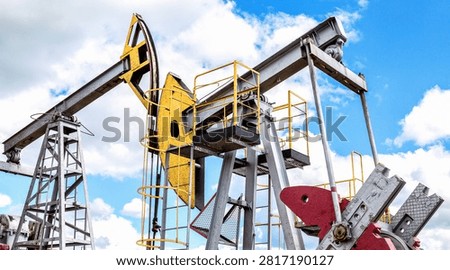 Working pump jack fracking crude extraction machine. Oil industry equipment