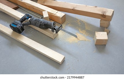 Working with a reciprocating saw - Power tool wood cutting construction theme - Shutterstock ID 2179944887