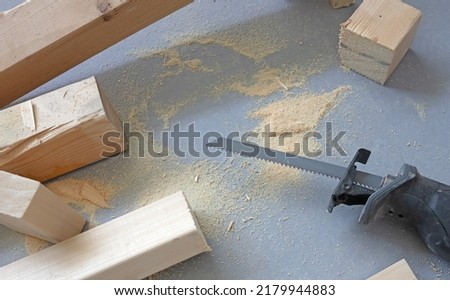 Working with a reciprocating saw - Power tool wood cutting construction theme