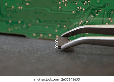 Working with semiconductor materials. Modern electronics and technology. Focused on 8-pin integrated circuit.



