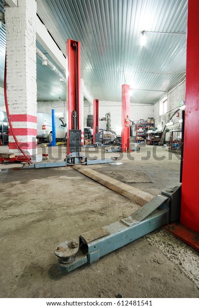 Working shop in a car repair\
station